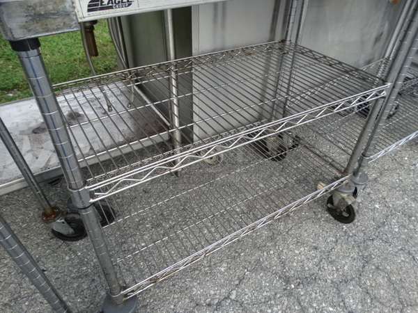Chrome Finish 2 Tier Metro Shelving Unit on Commercial Casters. 36x18x35. BUYER MUST DISMANTLE. PCI CANNOT  DISMANTLE FOR SHIPPING. PLEASE CONSIDER FREIGHT CHARGES.  - Image 4 of 4
