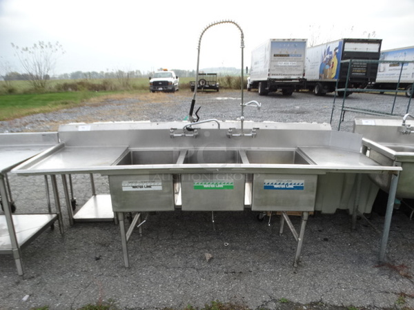 Stainless Steel Commercial 3 Bay Sink w/ Left Side Drainboard, Faucets, Handles and Spray Nozzle Attachment. 105x30x43. Bays 1824x12. Drainboard 22x27x2 - Image 1 of 9