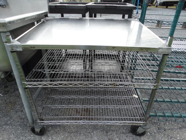 Chrome Finish 3 Tier Shelving Unit on Commercial Casters. 36x30x35. BUYER MUST DISMANTLE. PCI CANNOT  DISMANTLE FOR SHIPPING. PLEASE CONSIDER FREIGHT CHARGES.  - Image 1 of 4