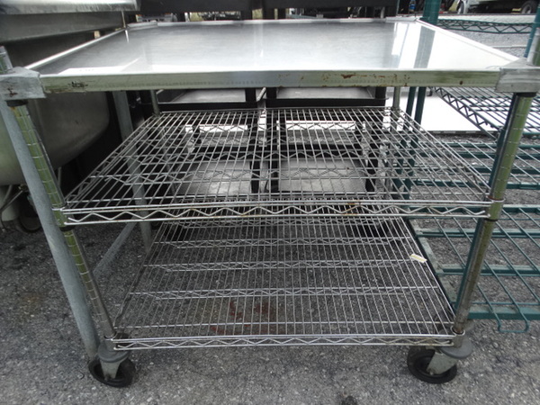 Chrome Finish 3 Tier Shelving Unit on Commercial Casters. 36x30x35. BUYER MUST DISMANTLE. PCI CANNOT  DISMANTLE FOR SHIPPING. PLEASE CONSIDER FREIGHT CHARGES.  - Image 4 of 4