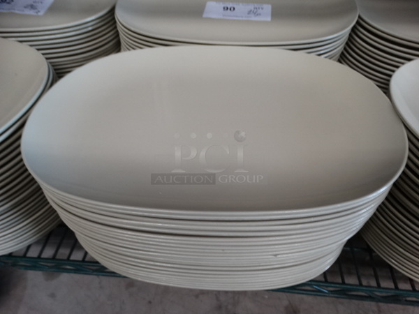 24 Carlisle Green Poly Plates. 13.75x9.5x1. 24 Times Your Bid!