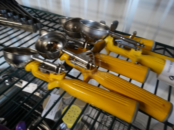 6 Metal Scoops w/ Yellow Handle. 9