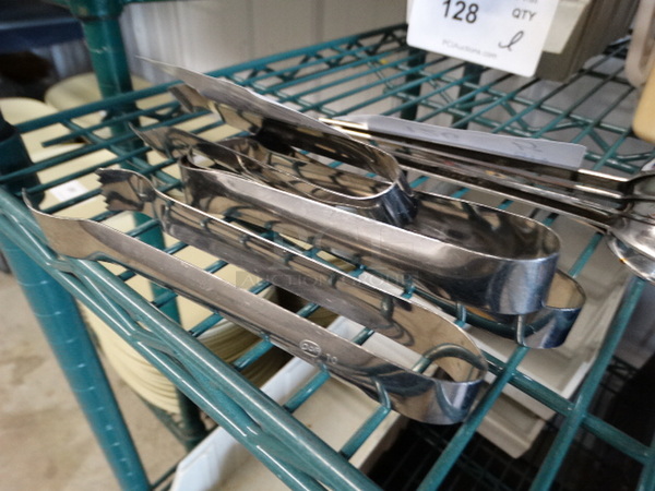 4 Metal Tongs. 6