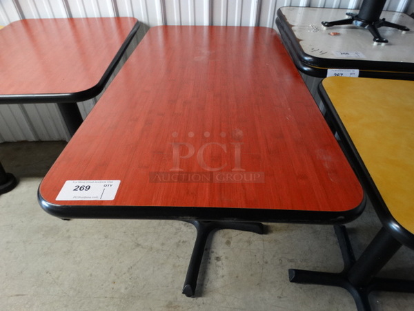 Red Table on Black Metal Table Base. 24x48x30