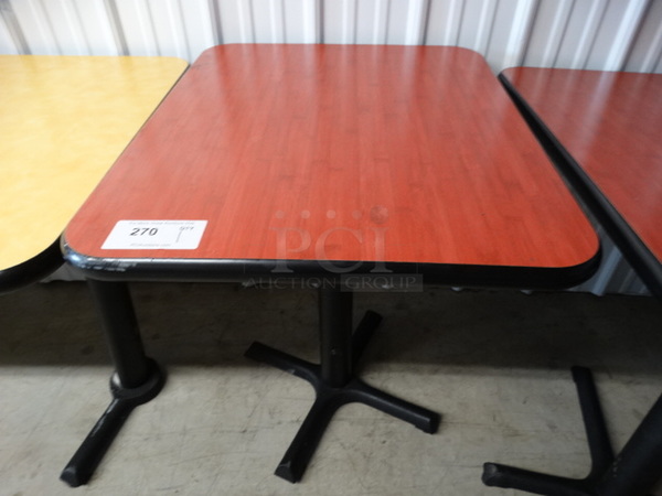 Red Table on Black Metal Table Base. 24x30x30