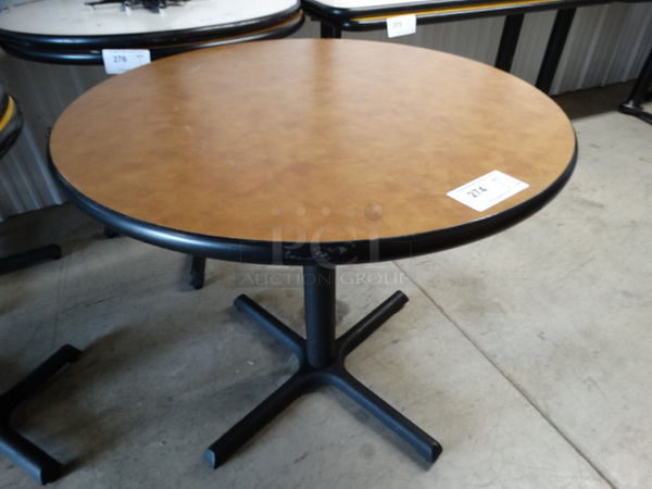 Round Brown Table on Black Metal Table Base. Stock Picture - Cosmetic Condition May Vary. 34x34x30