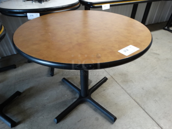 Round Brown Table on Black Metal Table Base. Stock Picture - Cosmetic Condition May Vary. 34x34x30 - Image 1 of 4