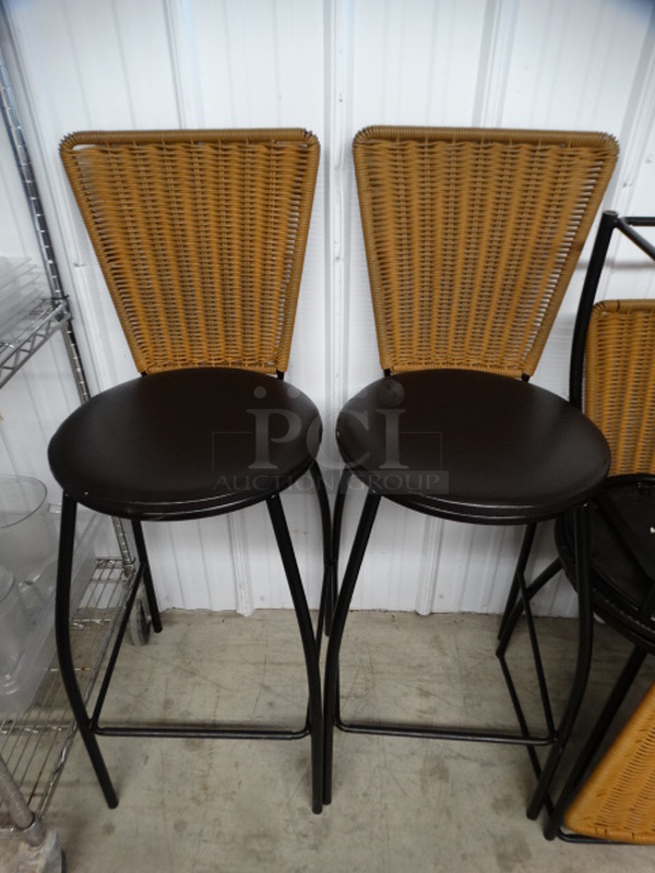 2 Bar Height Chairs w/ Wicker Style Backrest and Brown Seat Cushion on Black Metal Frame. 18x18x44. 2 Times Your Bid!
