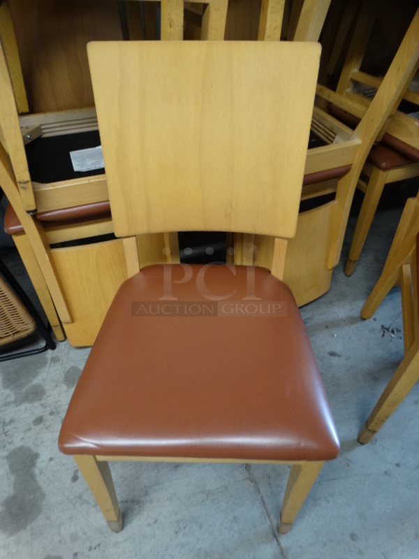 4 Wood Pattern Dining Chairs w/ Brown Seat Cushion. Stock Picture - Cosmetic Condition May Vary. 18x18x35. 4 Times Your Bid!