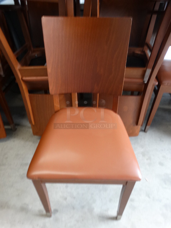 4 Dark Wood Pattern Dining Chairs w/ Brown Seat Cushion. Stock Picture - Cosmetic Condition May Vary. 18x18x35. 4 Times Your Bid!