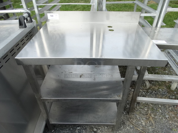 Stainless Steel Table w/ Backsplash and 2 Undershelves. 34x24x40