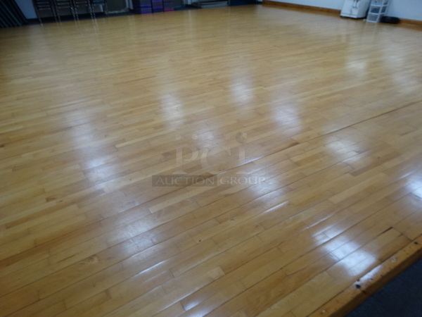Wood Pattern Flooring. Covers Approximately 34'x33'. BUYER MUST REMOVE