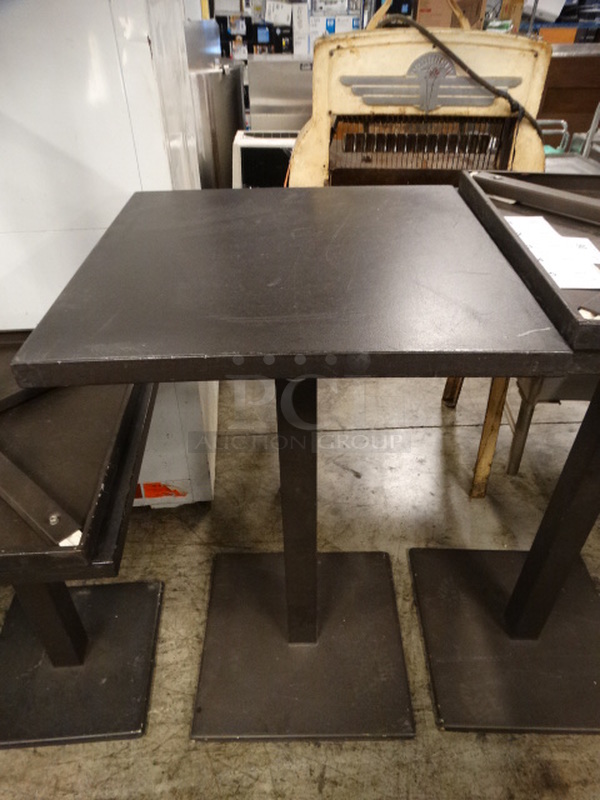 Brown Metal Bar Height Table on Metal Base. Stock Picture - Cosmetic Condition May Vary. 23.5x23.5x41