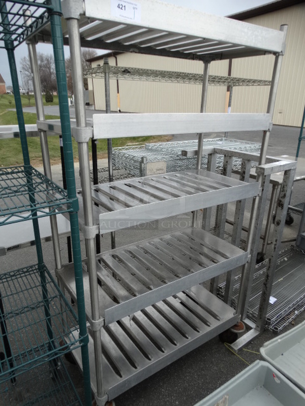 Metal 5 Tier Shelving Unit on Commercial Casters. 40x20x72. BUYER MUST DISMANTLE. PCI CANNOT DISMANTLE FOR SHIPPING. PLEASE CONSIDER FREIGHT CHARGES.