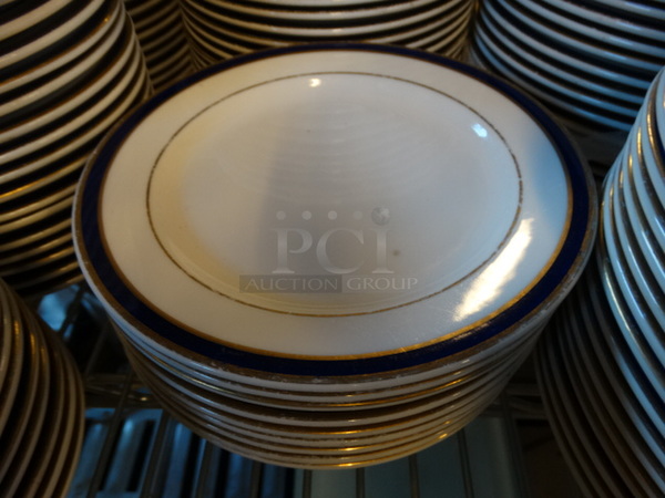 20 White Ceramic Plates w/ Blue and Gold Colored Lines on Rim. 7.25x7.25x1. 20 Times Your Bid!
