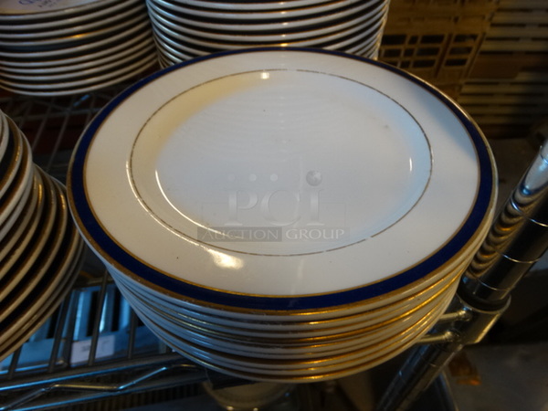 10 White Ceramic Plates w/ Blue and Gold Colored Lines on Rim. 8.25x8.25x1. 10 Times Your Bid!