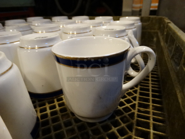 24 Various White Ceramic Mugs in Dish Caddy. Includes 4.5x3x3.5. 24 Times Your Bid!