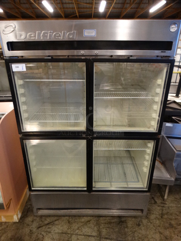 GREAT! Delfield Stainless Steel Commercial 4 Half Size Door Reach In Freezer Merchandiser on Commercial Casters. 51x33x79. Tested and Working!