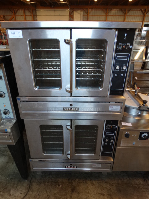 2 FANTASTIC! Garland Model K12 Stainless Steel Commercial Natural Gas Powered Full Size Convection Ovens w/ View Through Doors and Metal Oven Racks. 80,000 BTU. 40x30x71. 2 Times Your Bid!