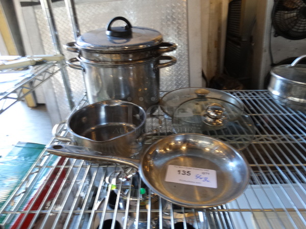 4 Various Stock Pots and SKillet w/ 3 Lids. Includes 14x11x7. 4 Times Your Bid!