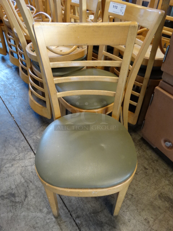 4 Wood Pattern Dining Chairs w/ Green Seat Cushion. Stock Picture - Cosmetic Condition May Vary. 17x19x33. 4 Times Your Bid!