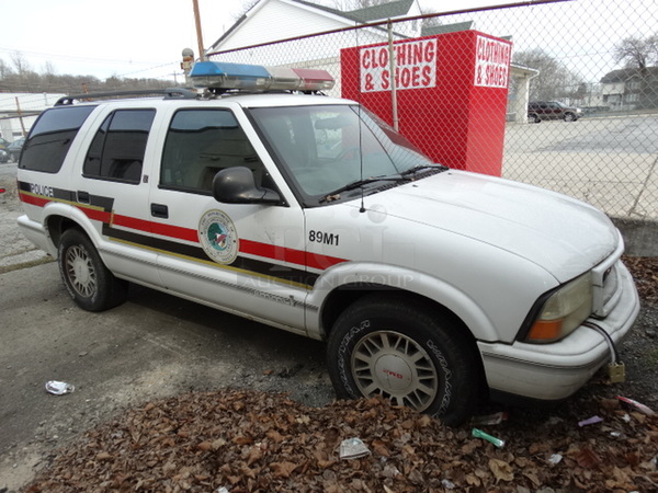 1998 GMC Jimmy SLS 4 Door SUV w/ Interior Cage Separator. Lot Includes Contents! VIN 1GKDT13W7W2558864. Comes w/ Clean Title. See Lot 23 For Additional Pictures!