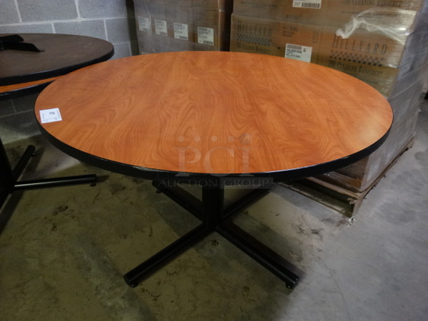Wood Pattern Round Table on Black Metal Table Base. Stock Picture - Cosmetic Condition May Vary. 48x48x30