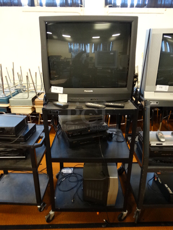 ALL ONE MONEY! Lot of Panasonic TV, Magnavox VHS DVD Player, Panasonic DVD Player, Panasonic Desktop Editor, Toshiba Model MV13N3 TV and Black 3 Tier AV Cart on Casters! Cart: 30.5x26x48.5