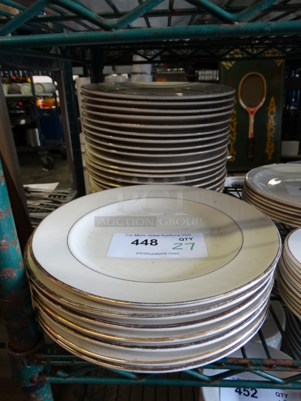 27 White Ceramic Plates w/ Gold Finish Lines on Rim. 10x10x1. 27 Times Your Bid!