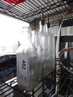 4 Glass Bottles. 2.5x2.5x8, 2.5x2.5x12. 4 Times Your Bid!