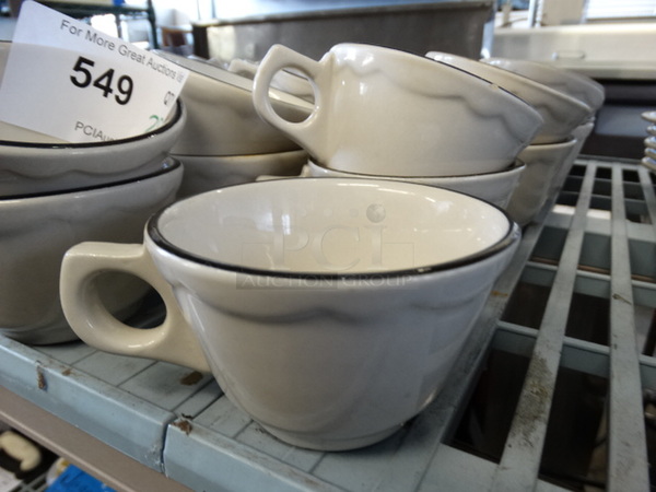 28 White Ceramic Mugs w/ Black Line on Rim. 5x4x2.5. 28 Times Your Bid!