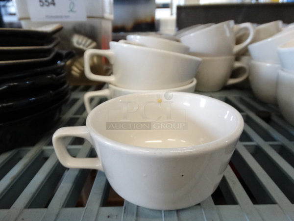 12 White Ceramic Mugs. 4.5x3.5x2.5. 12 Times Your Bid!