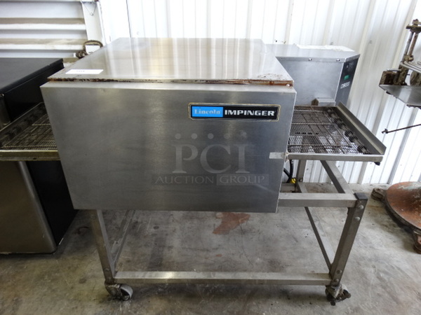 BEAUTIFUL! Lincoln Impinger Model 1132-000-A Stainless Steel Commercial Electric Powered Conveyor Pizza Oven on Commercial Casters. 208 Volts, 3 Phase. 61x37x43