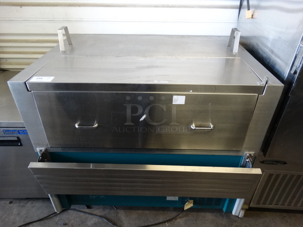 NICE! Servolift Eastern Model PDFRS-1313-12 Stainless Steel Commercial Milk Cooler w/ Tray Slide on Commercial Casters. 50x38x51. Tested and Powers On But Does Not Get Cold
