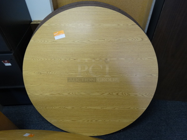 4 Wood Pattern Round Tabletops. 42x42x1. 4 Times Your Bid! (Room 14)