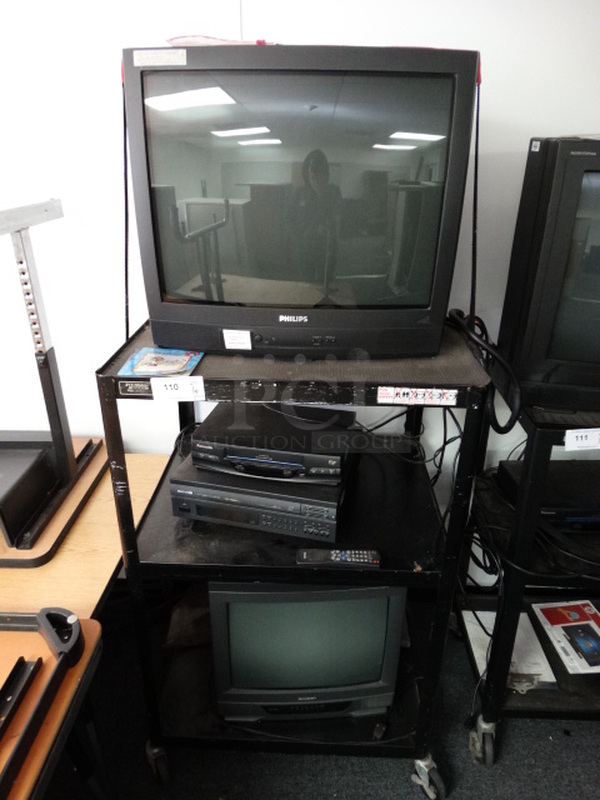 ALL ONE MONEY! Lot of Philips Television, Sharp Television, Panasonic VHS Tape and Magnavox VHS Player on Black Metal AV Cart on Commercial Casters! (Room 13)