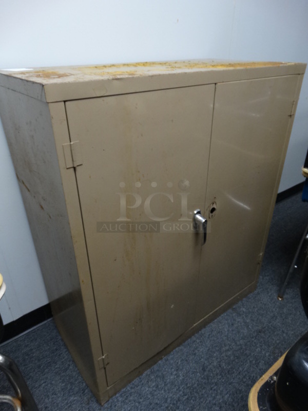 Tan Metal 2 Door Cabinet. 36x18x42. (Room 12A/12B)