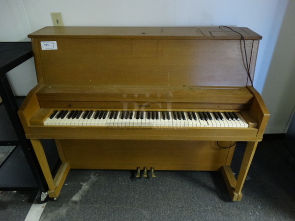 Kimball Wood Pattern Piano on Casters. 56x25x46. (Hallway)