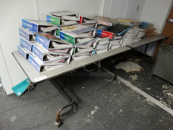 ALL ONE MONEY! Lot of Various Educational Binders and Books on Fold Up Table! Table 122x30x29. (Hallway)