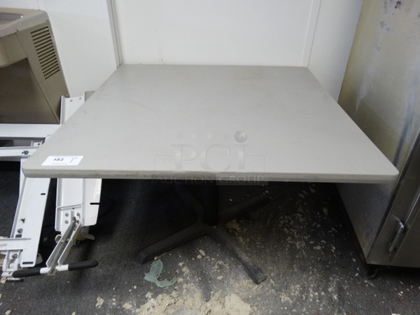 Gray Table on Metal Leg. 42x42x30. (Hallway)