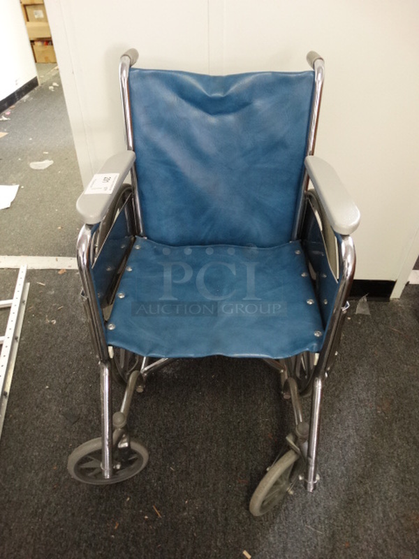 Blue Wheelchair w/ Metal Frame. 25x36x36. (Hallway)