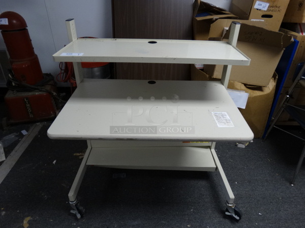 White 2 Tier Table on Commercial Casters. 38x24x42. (Lobby)