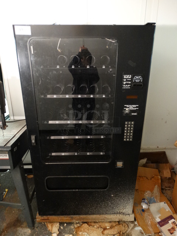 NICE! Black Metal Commercial Snack Vending Machine w/ Coin/Cash Acceptor. 38x31x68. (Hallway)