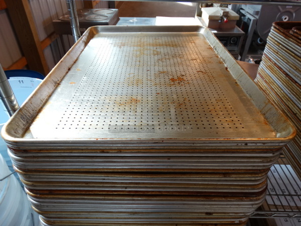 12 Metal Full Size Perforated Baking Pans. 18x26x1. 12 Times Your Bid!