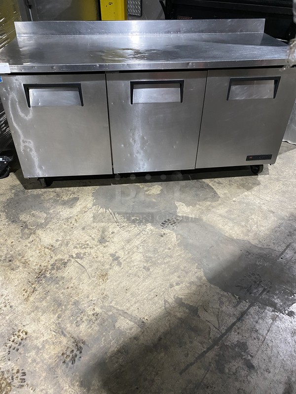 True Commercial 3 Door Refrigerated Lowboy/Worktop Cooler! With Backsplash! With Poly Coated Racks! All Stainless Steel! Model TWT72 Serial 7938940! 115V 1Phase! On Commercial Casters!