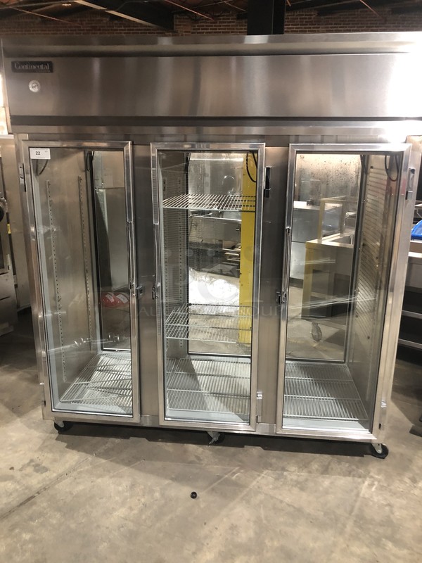 FABULOUS! Continental Commercial 3 Door Reach In/Pass Through Refrigerator Merchandiser! With Poly Coated Racks! All Stainless Steel! Model 3RGDPT Serial 14552378! 115/208/230V 1Phase! On Commercial Casters!