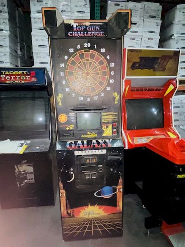 PERFECT ADDITION!! GoldStar Galaxy Series Dart Games, Model: MBM-2105A - Dartman 2. Programed for indiviudal and League Play. 120V 60Hz .35Amps.  Turns on. The screen is faded slightly in the center and the sensors on the board will need to be recalibrated for sensitivity. Structurally Sound. Programing works as should be expected. Includes Manuals and all relevant paper work.     Coin operated.