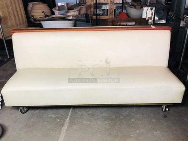 LIKE NEW!! Faux Leather, Wood Framed Double Sided Cushioned Booth Seat on Commercial Dolly For Easy Transport. WIDTH: 80-1/4 DEPTH: 55 HEIGHT: 37
