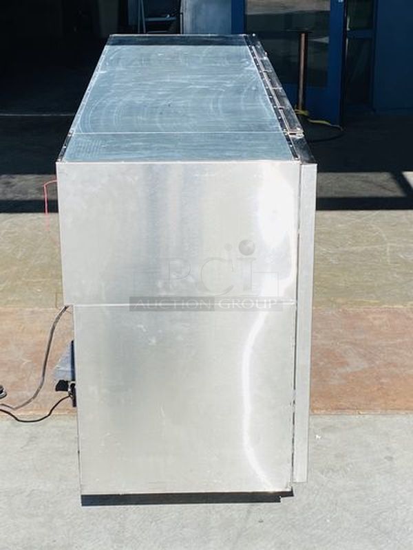 LIKE NEW! Krowne Back Bar. Model BS84L-KNB-LLR 115V, 60Hz, 1Ph, 9A. 35x84x24 Removed from the SLS. Used Briefly

35" high without top, 36" high 
24" front to back depth 
All stainless steel, coved corner interior with LED lighting Digital Thermostat Sideblow refrigeration 
High performance refrigeration system
Expansion valve with 134A refrigerant
Operating range of 30°F - 40°F (Preset at 35°F)
Heavy duty 18-gauge door jambs
NSF epoxy coated durable shelves. One bottom and two adjustable shelves per door.

*Due to EPA Regulations the Freon was removed.  - Image 2 of 9