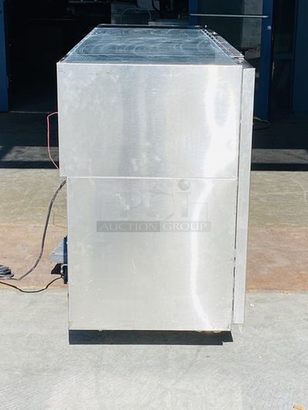 LIKE NEW! Krowne Back Bar. Model BS84L-KNB-LLR 115V, 60Hz, 1Ph, 9A. 35x84x24 Removed from the SLS. Used Briefly

35" high without top, 36" high 
24" front to back depth 
All stainless steel, coved corner interior with LED lighting Digital Thermostat Sideblow refrigeration 
High performance refrigeration system
Expansion valve with 134A refrigerant
Operating range of 30°F - 40°F (Preset at 35°F)
Heavy duty 18-gauge door jambs
NSF epoxy coated durable shelves. One bottom and two adjustable shelves per door.

*Due to EPA Regulations the Freon was removed.  - Image 3 of 9